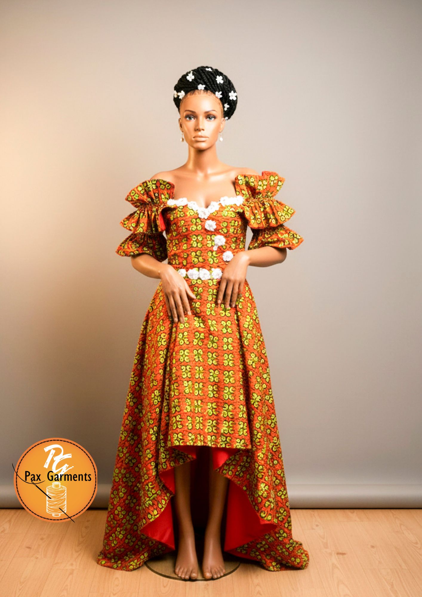  Vibrant orange and green Ankara print with distinctive ruffle cap sleeves.   