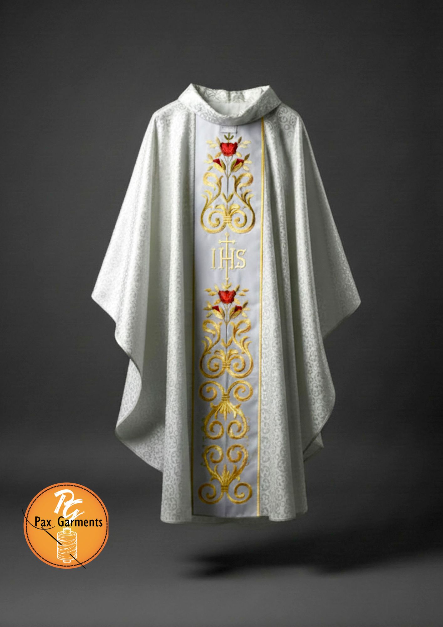  White Gothic-style chasuble features intricate golden IHS embroidery on a damask or brocade fabric.