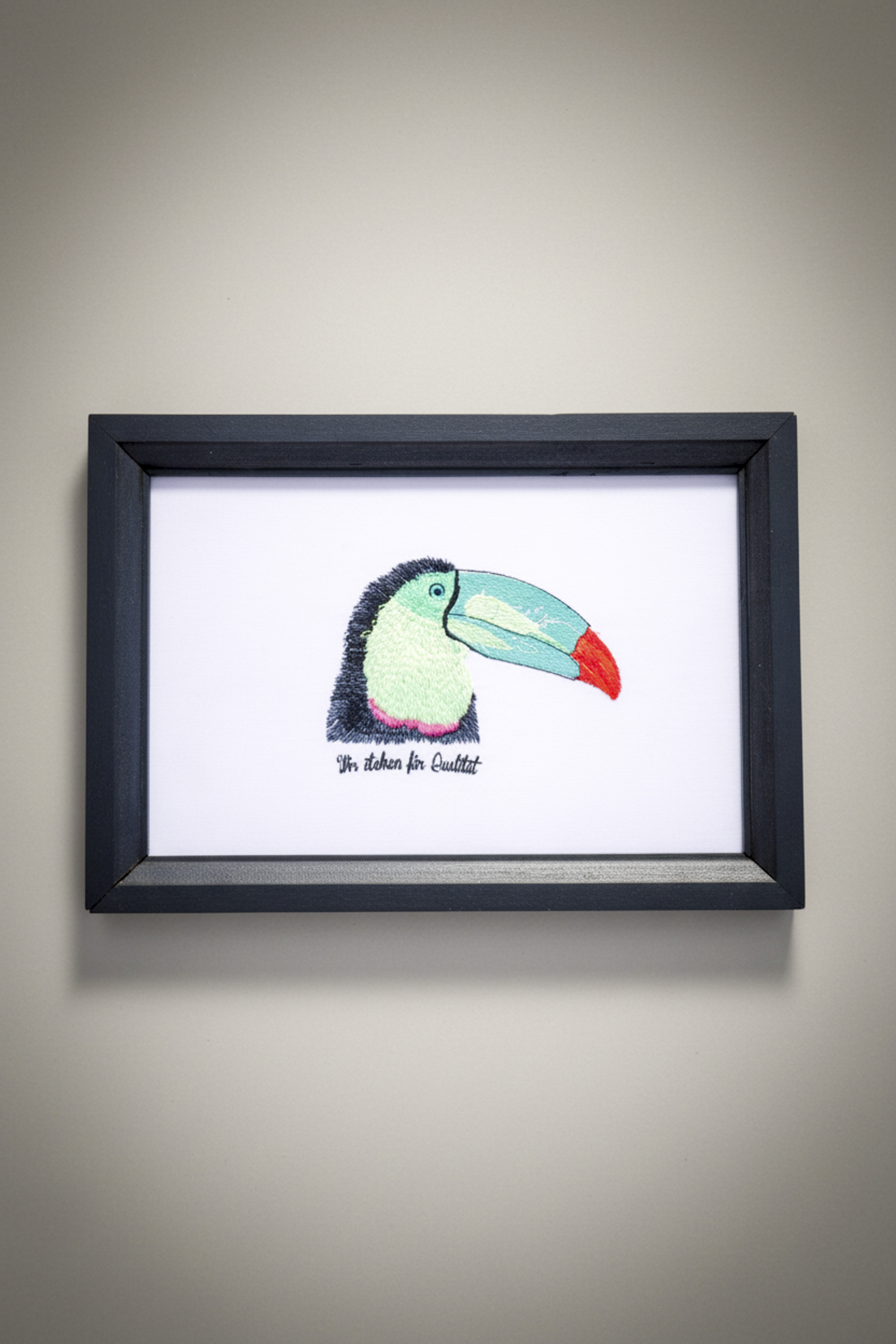 A tropical toucan featuring a blue and orange beak.