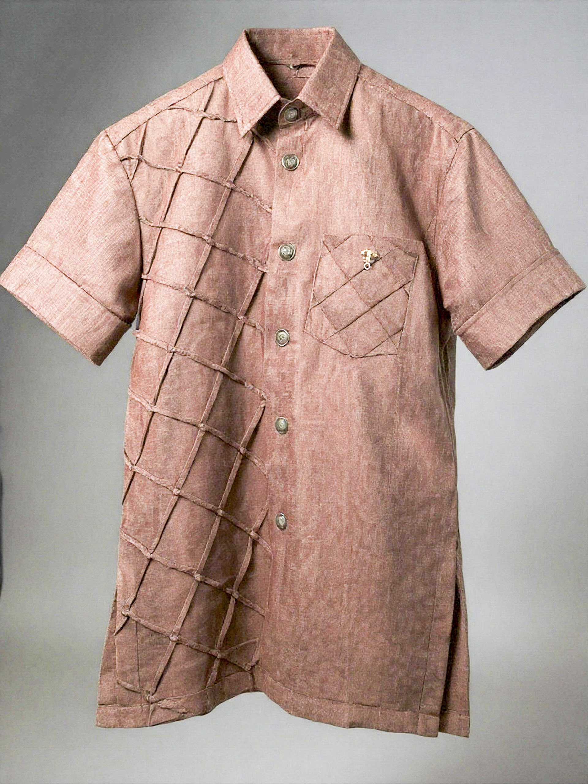 Rose-colored linen design featuring a unique grid-patterned texture on the left side and pocket. 