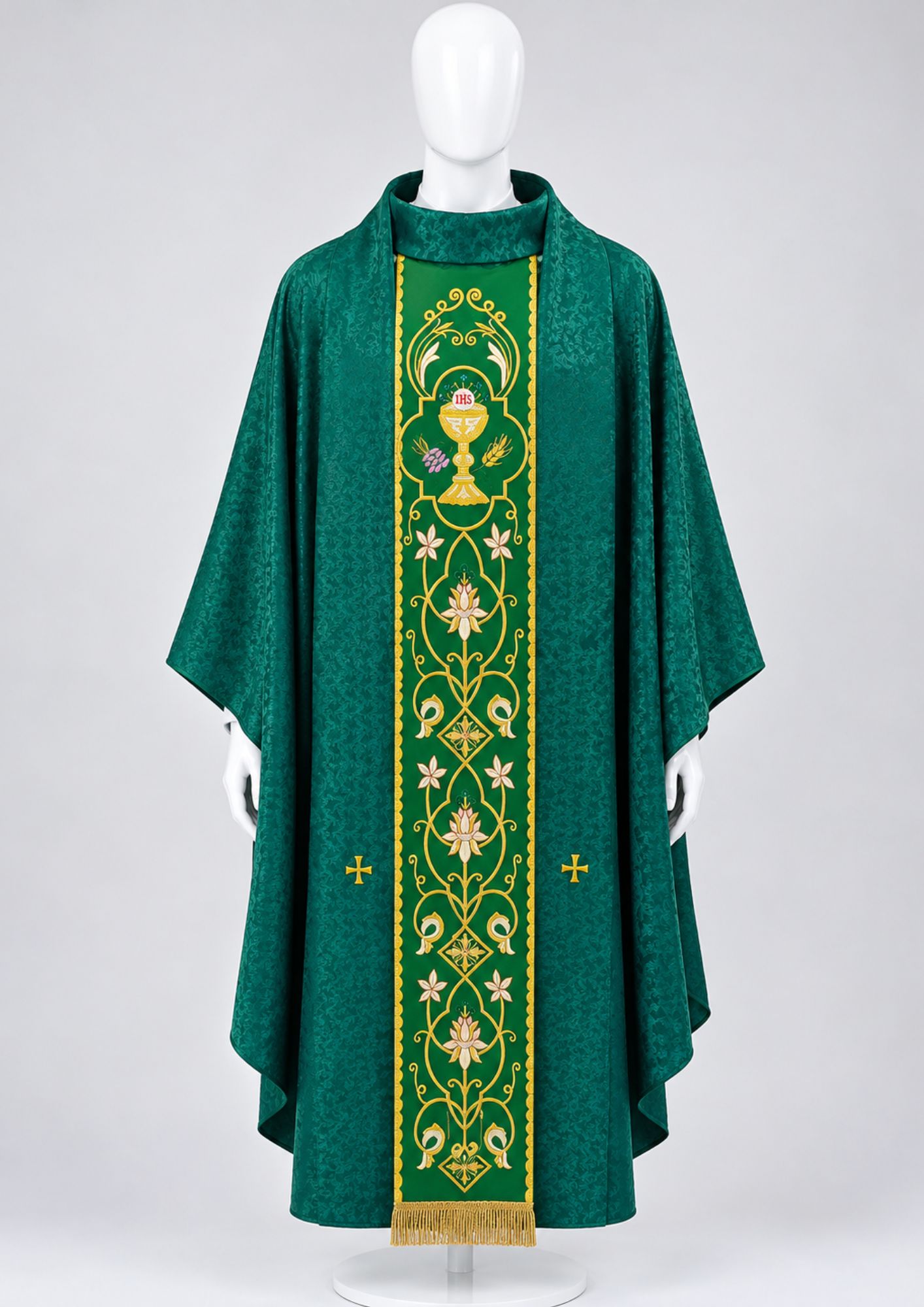 Green liturgical chasuble featuring intricate gold embroidery and a central chalice and IHS motif.